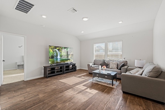 living room featuring dark hardwood / wood-style flooring and lofted ceiling