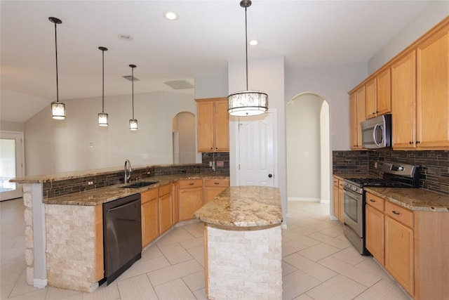 1709 Todd Ln, Cedar Park, TX 78613 - kitchen with stainless steel appliances, arched walkways, a peninsula, a sink, and recessed lighting