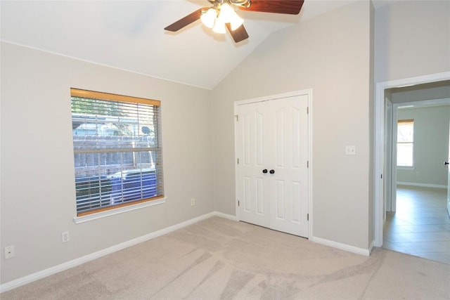 1709 Todd Ln, Cedar Park, TX 78613 - unfurnished bedroom with light colored carpet, vaulted ceiling, a closet, baseboards, and a ceiling fan