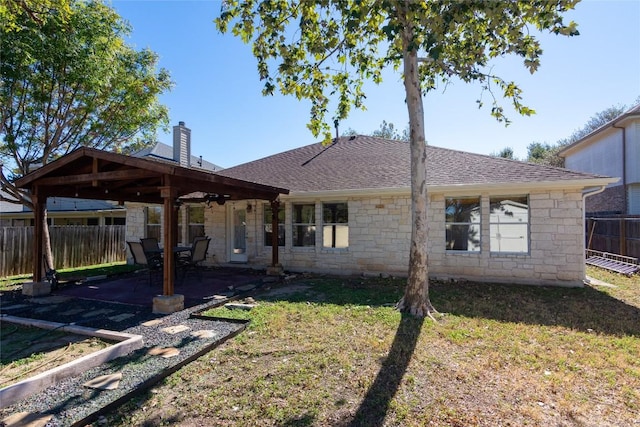 1709 Todd Ln, Cedar Park, TX 78613 - rear view of house featuring stone siding, a chimney, a patio, and roof with shingles