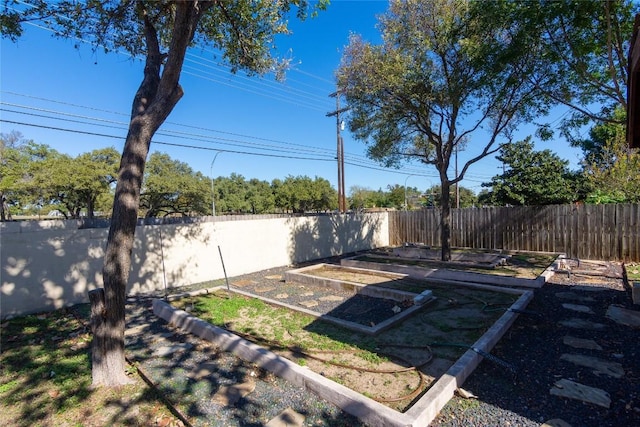 1709 Todd Ln, Cedar Park, TX 78613 - fenced backyard with a vegetable garden