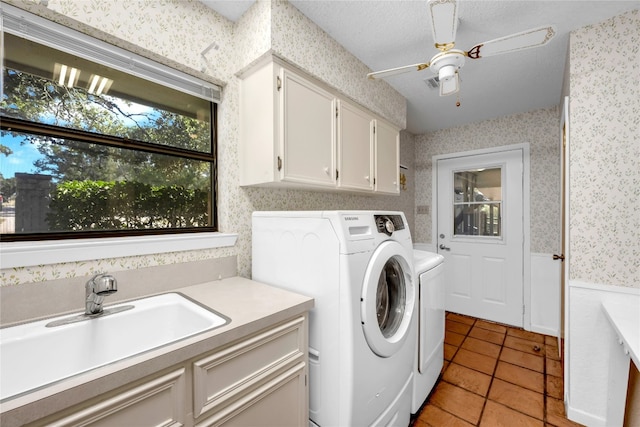 washroom featuring washer and clothes dryer, light tile patterned floors, cabinets, and sink