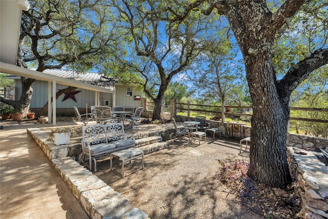 view of patio featuring ceiling fan