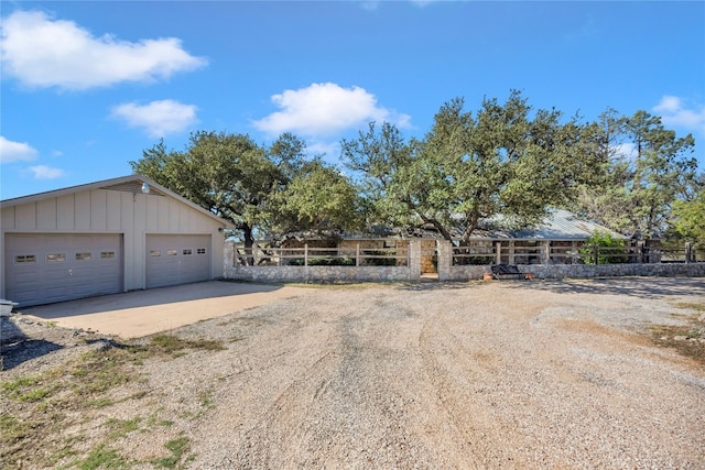 view of front of house with an outdoor structure and a garage