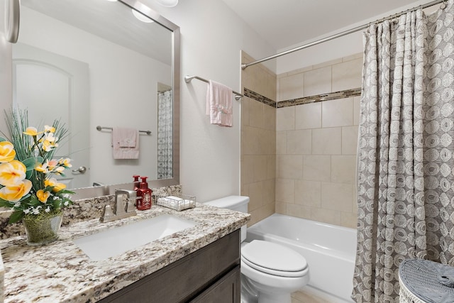 full bathroom featuring shower / bath combination with curtain, vanity, and toilet