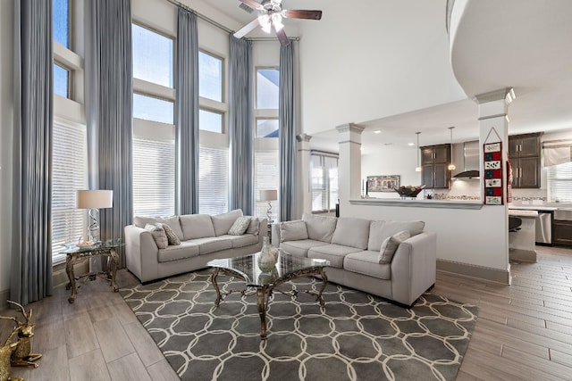 living room featuring a wealth of natural light and hardwood / wood-style flooring