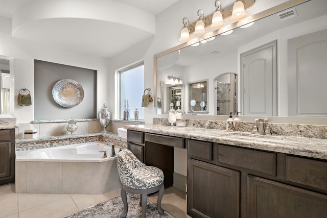 bathroom featuring tile patterned floors, vanity, and plus walk in shower