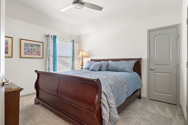 bedroom featuring ceiling fan and light colored carpet