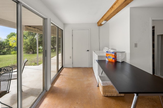 doorway to outside with beamed ceiling and plenty of natural light