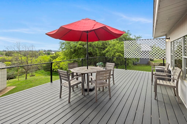 wooden terrace with a yard