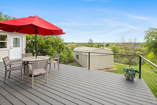 wooden deck with an outbuilding