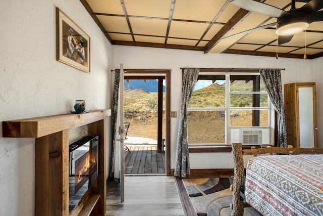 9301 Terlingua Ranch Rd Unit 8025, Alpine, TX 79852 - bedroom with wood-type flooring, access to outside, ceiling fan, and cooling unit