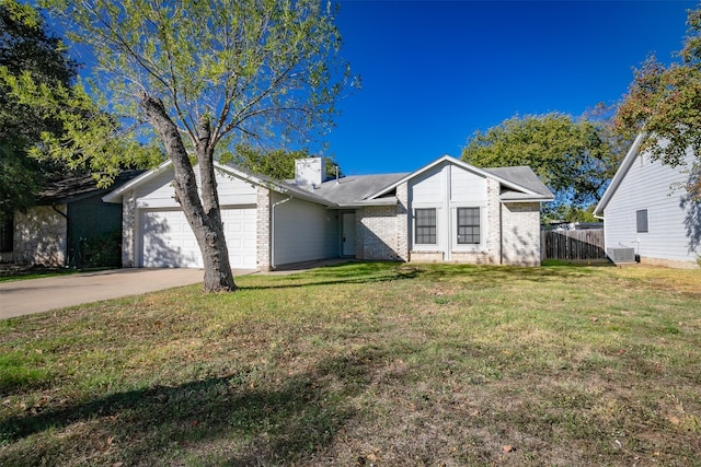 ranch-style house featuring a garage, a front yard, and central AC