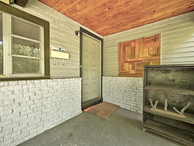 view of exterior entry with covered porch