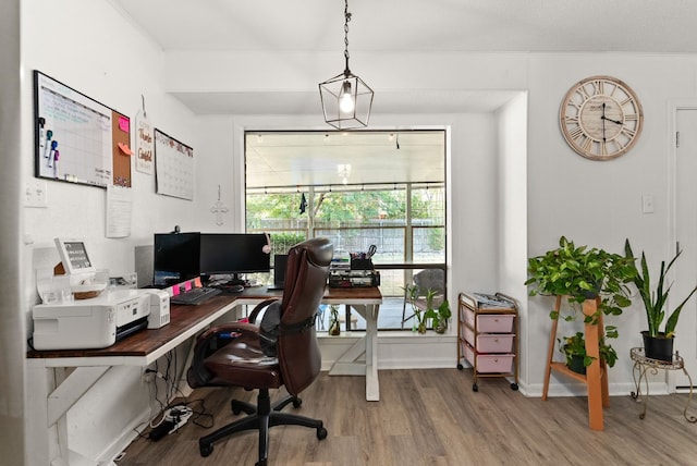 home office with wood-type flooring