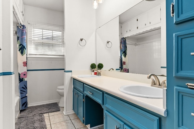 full bathroom featuring tile patterned floors, vanity, toilet, and shower / bathtub combination with curtain