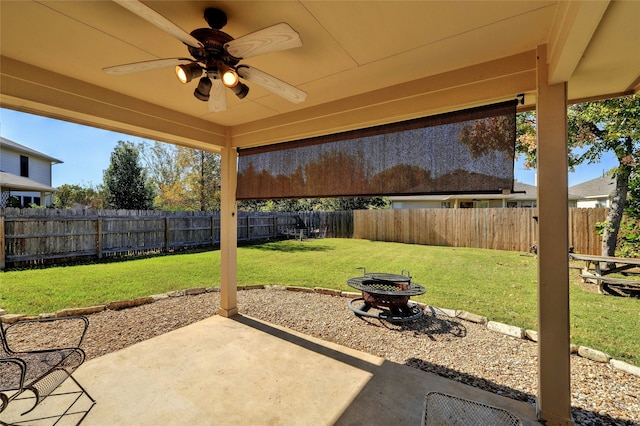 view of patio / terrace featuring ceiling fan and an outdoor fire pit