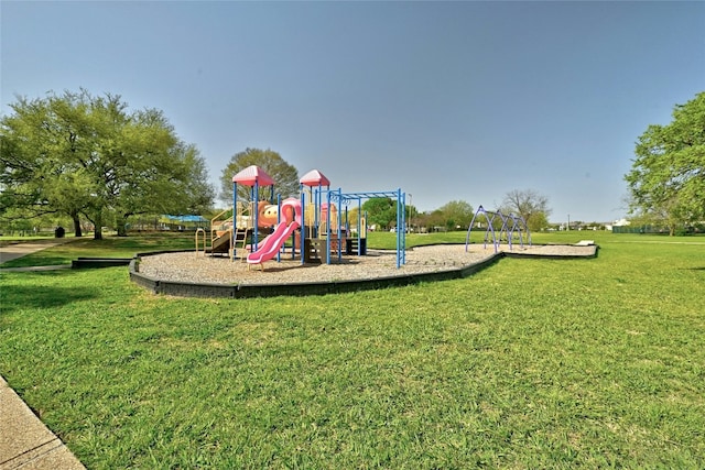 view of playground with a lawn