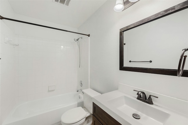 full bathroom featuring toilet, vanity, and tiled shower / bath combo