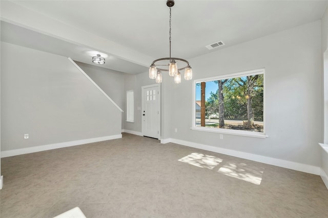 interior space featuring a chandelier