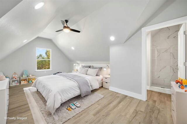 bedroom with ceiling fan, light wood-type flooring, and lofted ceiling