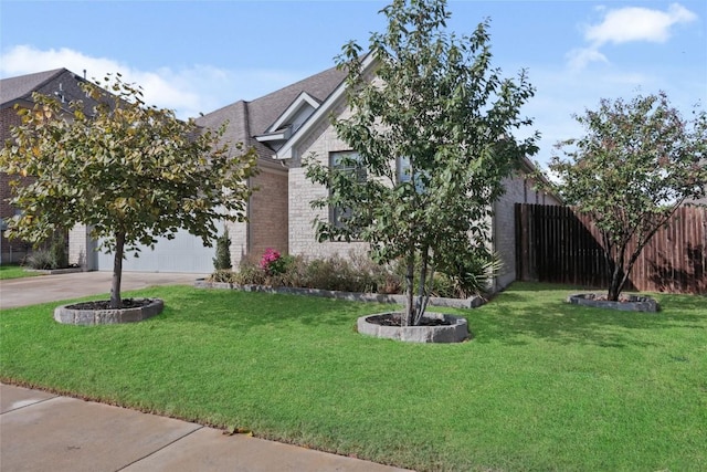 obstructed view of property with a front lawn