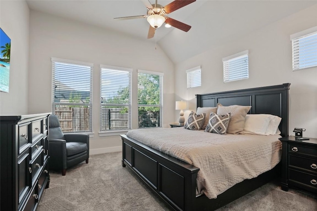 carpeted bedroom featuring multiple windows, ceiling fan, and high vaulted ceiling