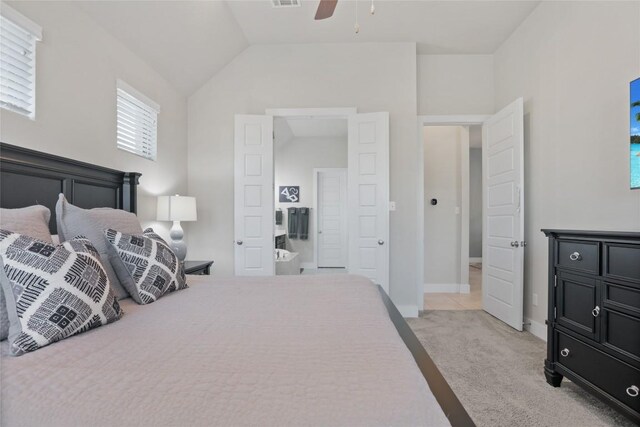 bedroom with light colored carpet, vaulted ceiling, and ceiling fan