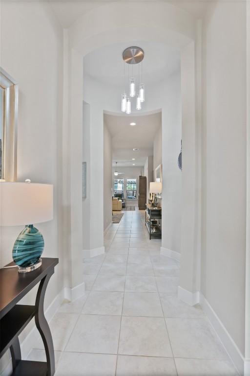 hallway with light tile patterned floors