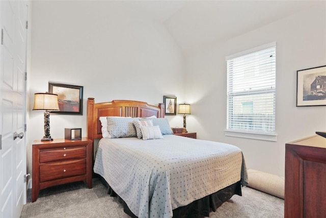 carpeted bedroom featuring vaulted ceiling