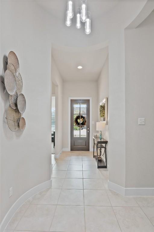 foyer entrance with light tile patterned floors