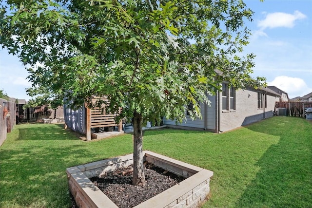 view of yard featuring central air condition unit