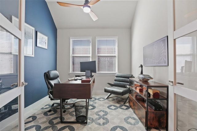 office area featuring vaulted ceiling, ceiling fan, and a healthy amount of sunlight