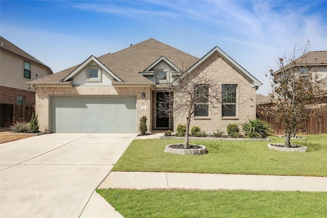 view of front of house featuring an attached garage, brick siding, fence, concrete driveway, and a front lawn