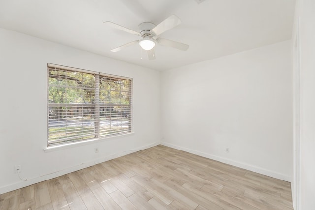 spare room featuring ceiling fan and light wood-type flooring