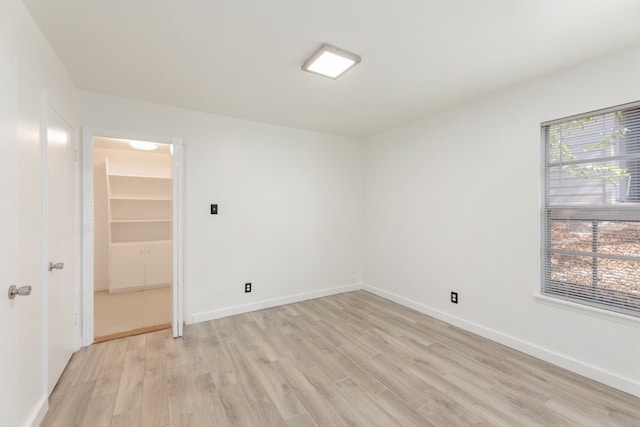 spare room with light wood-type flooring