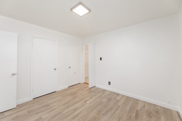 unfurnished bedroom featuring light hardwood / wood-style floors