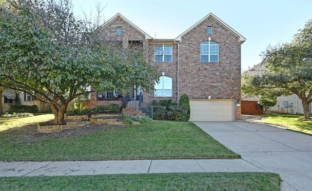 view of front facade featuring a garage and a front lawn