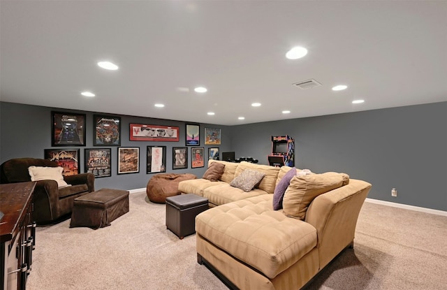 home theater room featuring light carpet