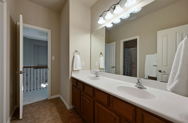 bathroom with tile patterned floors and vanity