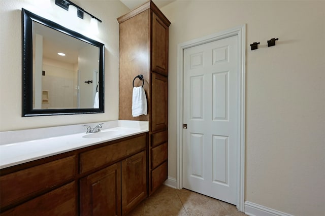 bathroom featuring tile patterned flooring and vanity