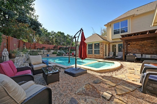 view of swimming pool with an in ground hot tub and an outdoor living space