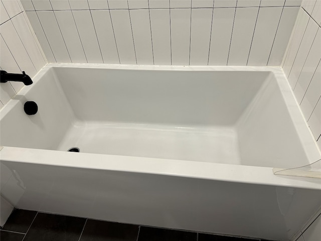 bathroom with tile patterned floors