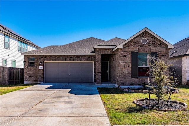 view of front facade featuring a garage and a front lawn