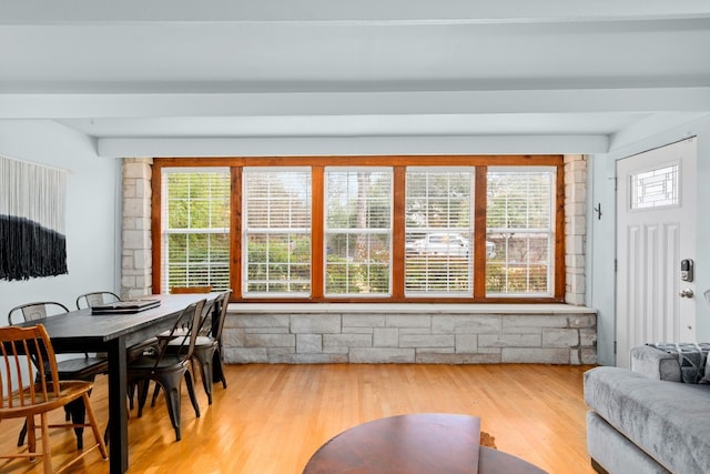 dining space with wood-type flooring