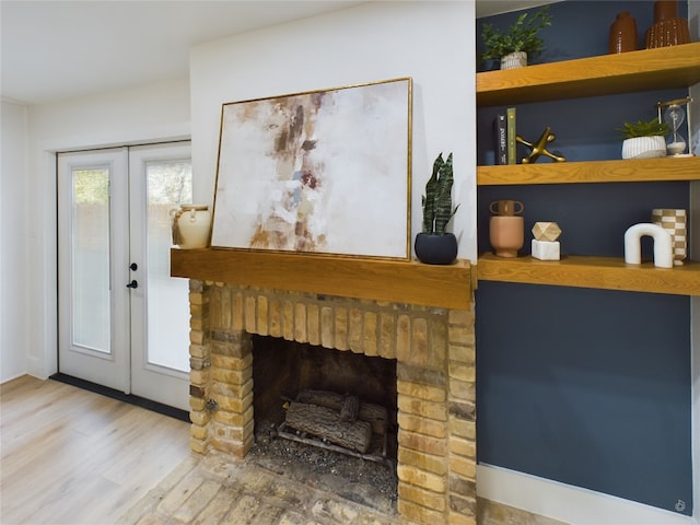 details with hardwood / wood-style flooring, a fireplace, and french doors