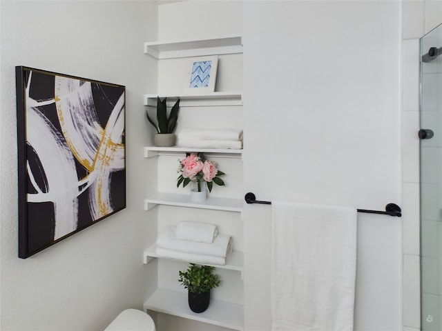 bathroom with a shower with shower door