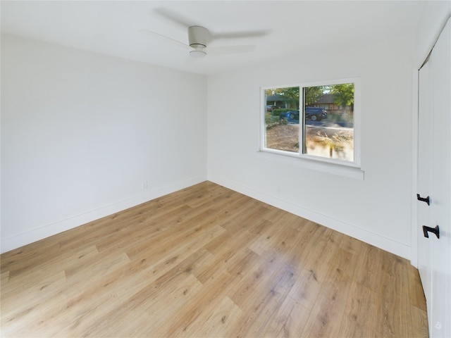 unfurnished room featuring ceiling fan and light hardwood / wood-style flooring