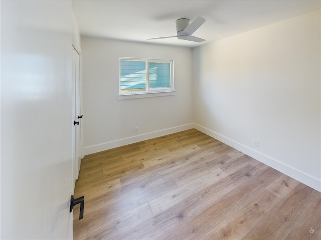 spare room with ceiling fan and light hardwood / wood-style flooring