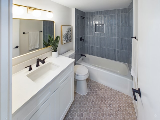 full bathroom with vanity, tiled shower / bath combo, toilet, and tile patterned flooring